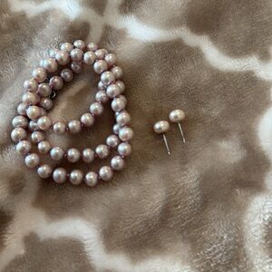Pink pearls set with earrings.